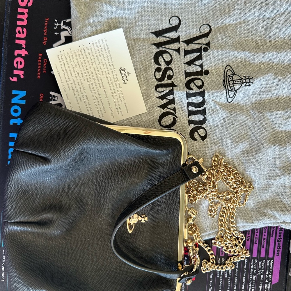 Vivienne Westwood Black Crossbody Bag with Gold Chain and leather handle.